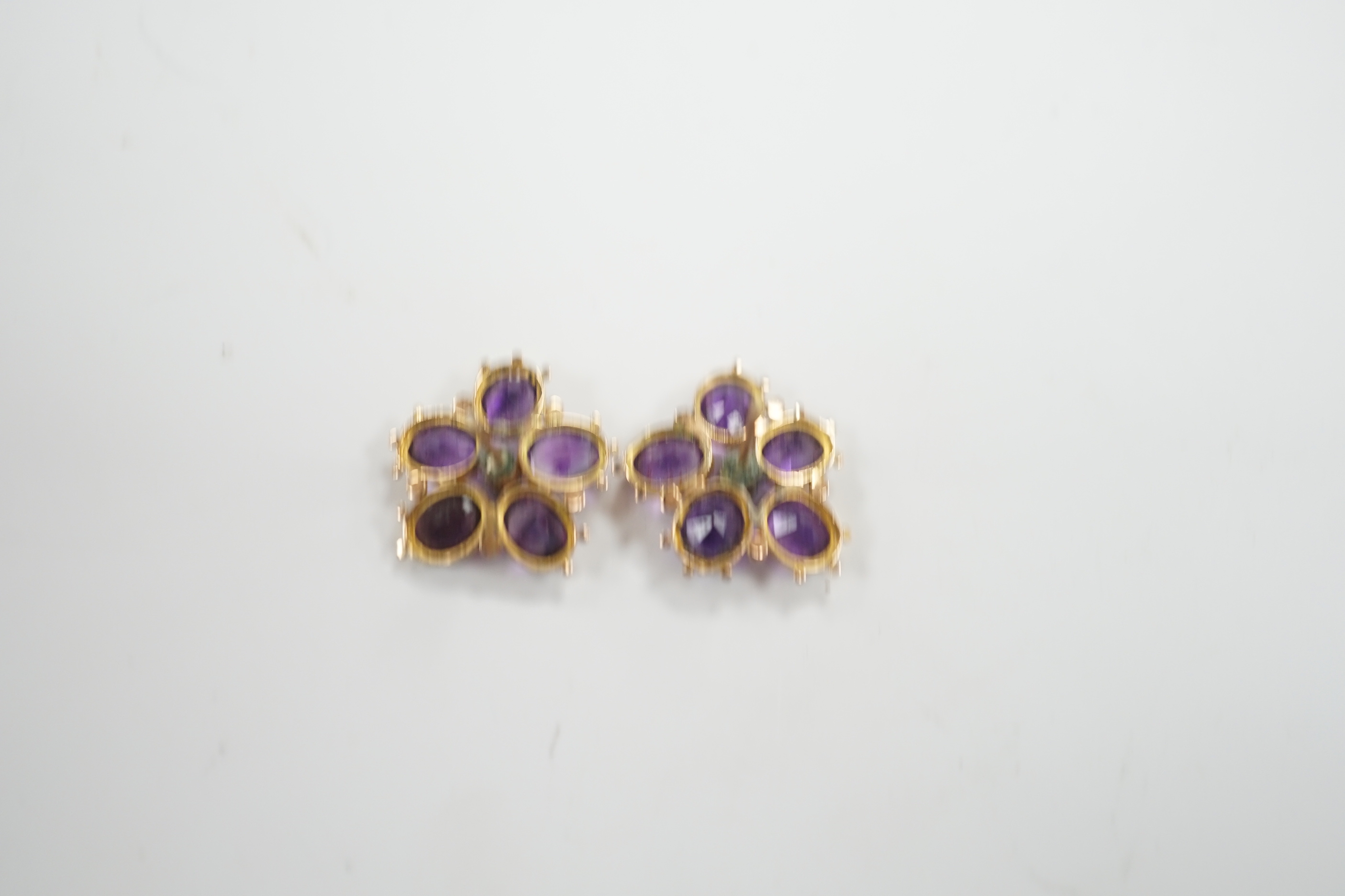 A pair of yellow metal, amethyst and seed pearl set flowerhead ear studs, 18mm, gross weight 4 grams.